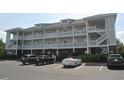 Condo exterior with multiple levels and balconies and parking in the front at 500 Wickham Dr. # 1070, Myrtle Beach, SC 29579