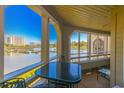 Enjoy the stunning water views from the screened porch with seating and table at 501 Maison Dr. # F8, Myrtle Beach, SC 29572