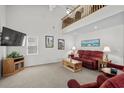 Bright living room featuring vaulted ceilings, a comfortable seating area, and ample natural light at 527 Bay Drive Ext., Garden City Beach, SC 29576