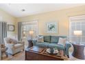 Comfortable living room with natural light, stylish seating, charming decor, and coastal-inspired accents at 708 Ashland Ave., North Myrtle Beach, SC 29582