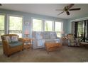 Relaxing living room with lots of natural light, comfortable seating, and wicker accents at 861 Tall Oaks Ct. # D-61, Myrtle Beach, SC 29588