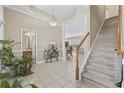 Inviting foyer with tile flooring, staircase, and views of the living spaces at 886 Carolina Farms Blvd., Myrtle Beach, SC 29579