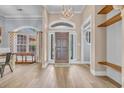 Elegant foyer showcasing hardwood floors and architectural details, enhanced by natural light at 1203 Crooked Oak Dr., Pawleys Island, SC 29585