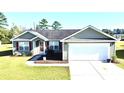 Charming single Gathering home with two-car garage, manicured lawn and attractive landscaping at 1220 Alcazar Ct., Conway, SC 29527