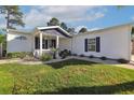 This property features a well-manicured lawn, a charming front porch, and beautiful landscaping at 1755 Fairbanks Dr., Conway, SC 29526