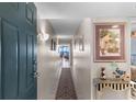 Inviting condo entryway with decorative art and a glimpse of the living area at 201 S Ocean Blvd., North Myrtle Beach, SC 29582