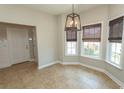 Cozy dining area features tile floors, pendant lighting, and large bay windows at 232 Palm Cove Circle, Myrtle Beach, SC 29588