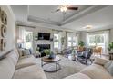 Bright and airy living room featuring a fireplace, large windows, and comfortable seating at 250 Mayflower Dr., Calabash, NC 28467