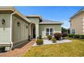 Home featuring an arched entryway and well-maintained landscaping in front yard at 274 Avenue Of The Palms, Myrtle Beach, SC 29579