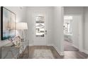Modern entryway with stylish console table, decor, and a view of the door and interior at 308 Glacier Way, Conway, SC 29526