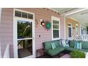 Cozy front porch with comfortable seating and decor at 3358 Pampas Dr., Myrtle Beach, SC 29577