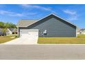 Spacious two-car garage with a concrete driveway and well-maintained lawn at 383 Hayloft Circle, Conway, SC 29526
