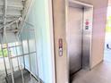Hallway shot of the elevator near stairs at 407 24Th Ave. N # 302, North Myrtle Beach, SC 29582