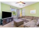 Comfortable living room with a plush sectional sofa, TV, and a sliding door to a balcony at 488 River Oaks Dr. # 61F, Myrtle Beach, SC 29579