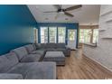 Cozy living room with a large sectional sofa, modern ceiling fan, and open layout at 601 Blue Daisy Ct., Loris, SC 29569
