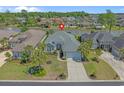 Aerial view of home with beautiful landscaping, serene lake view and great curb appeal at 631 Edgecreek Dr., Myrtle Beach, SC 29579