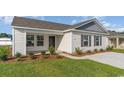 Inviting front porch with a charming design and meticulously maintained landscaping at 663 Culmen Ct., Myrtle Beach, SC 29588