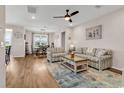 Inviting living room and dining room featuring hardwood floors, neutral tones, and lots of natural light at 684 Wailea Circle, Little River, SC 29566