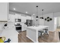 Modern kitchen with white cabinetry, stainless steel appliances, and a large center island at 732 Mustang Ranch Dr., Myrtle Beach, SC 29588