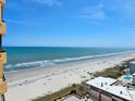 Breathtaking ocean view from the condo, featuring a beautiful sandy beach and sparkling blue waters at 9650 Shore Dr. # 1203, Myrtle Beach, SC 29572