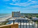 Expansive ocean and city views from the condo balcony, showcasing beautiful scenery and nearby buildings at 9650 Shore Dr. # 1203, Myrtle Beach, SC 29572