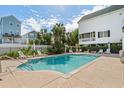 A refreshing community swimming pool with lounge chairs near the property at 113A 9Th Ave. S, Surfside Beach, SC 29575