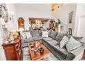 Spacious living room with a large sectional sofa, high ceilings, and elegant decor create a cozy atmosphere at 1147 Fairway Ln. # 1147, Conway, SC 29526