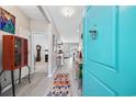 Bright entryway with colorful accents, light floors, and a glimpse into the spacious living areas at 125 Mountain Ash Ln., Myrtle Beach, SC 29579