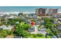 Aerial view of a charming home near the beach, close to amenities, and with lush greenery at 1314 Holly Dr., North Myrtle Beach, SC 29582