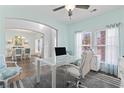 Home office featuring a large glass desk, comfortable chair, and natural light at 1416 Castleberry Pl., Myrtle Beach, SC 29588