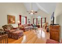 Spacious living room with vaulted ceiling, hardwood floors, and a view of the front windows at 1729 Longleaf Dr., Myrtle Beach, SC 29575