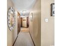 Hallway with neutral paint, carpet, and a shell-encrusted mirror in a well-maintained home at 200 76Th Ave. N # 301, Myrtle Beach, SC 29572