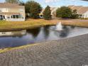 Peaceful pond with a fountain, surrounded by well-maintained lawns at 238 Seabert Rd. # 238, Myrtle Beach, SC 29579
