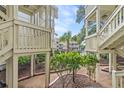 Landscaped courtyard of a building complex featuring foliage and a view of other buildings at 2805 N Ocean Blvd. # 113, Myrtle Beach, SC 29577