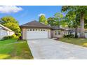 Charming single story home with a two-car garage and well maintained lawn in a desirable community at 3107 Robyn Ct., Little River, SC 29566