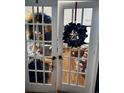 Office seen through glass paneled french doors, offering privacy and natural light at 3293 Schoolhouse Dr., Hemingway, SC 29554