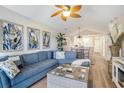 Inviting living room with vaulted ceilings, comfortable seating, stylish decor, and a view to the dining area at 342 Pinehurst Ln. # 12J, Pawleys Island, SC 29585