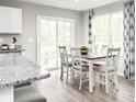 Bright dining room with a sliding glass door and lots of windows, and room to gather at 355 Myrtle Meadows Dr # B, Conway, SC 29526