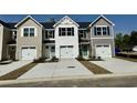 New townhomes feature Hardie siding, paired garages, private drives, and professionally landscaped yards at 355 Myrtle Meadows Dr # B, Conway, SC 29526
