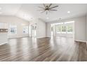 Open-concept living room with abundant natural light and modern flooring at 3725 Park Pointe Ave., Little River, SC 29566