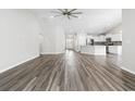 Spacious living room with hardwood floors connecting to the modern kitchen at 3725 Park Pointe Ave., Little River, SC 29566
