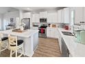 Bright kitchen featuring stainless steel appliances, sleek countertops, and an island with bar seating at 40 Little Peru Ct., Georgetown, SC 29440