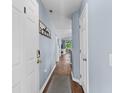 Inviting entryway with wood floors, coat hooks and a view of the living area at 453 Red River Ct. # 38 I, Myrtle Beach, SC 29579