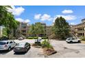 Condo exterior with multiple floors, parking, and staircase access to all units at 501 Maison Dr. # F14, Myrtle Beach, SC 29572