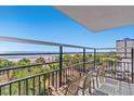 Relaxing balcony with views of the Atlantic Ocean and beach palm trees at 504 N Ocean Blvd. N # 309, Myrtle Beach, SC 29577