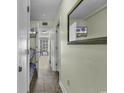 Hallway with tile flooring leads to rooms with beach-themed decor at 5905 South Kings Hwy. # 433, Myrtle Beach, SC 29575