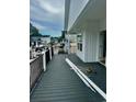 View from the deck of a neighborhood with railings, and construction materials staged on the deck for finishing at 6001 - 1766 S Kings Hwy., Myrtle Beach, SC 29575