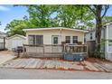 Charming beach home featuring a spacious wooden deck, convenient parking, and storage shed for all your beach necessities at 6001 - 1807 S Kings Hwy., Myrtle Beach, SC 29575
