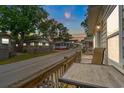 Beautiful street view of a charming neighborhood with well-maintained homes, wooden decks, and a serene atmosphere at 6001 - 1807 S Kings Hwy., Myrtle Beach, SC 29575
