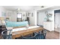 Comfortable living area with a blend of modern and rustic beach decor, adjacent to a kitchenette at 6001 N Ocean Blvd. # 342, North Myrtle Beach, SC 29582